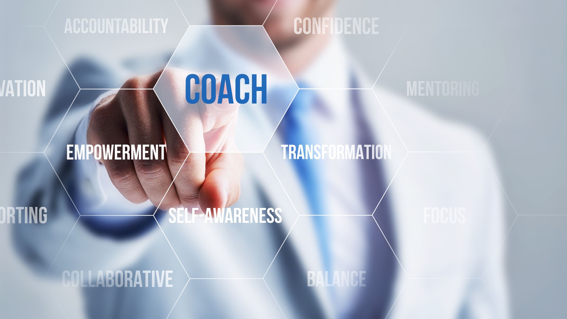 Businessman ponting Coach with his finger on a touch screen